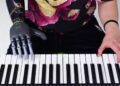 BrainCo helps amputee play piano alongside robot